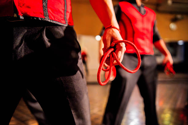 A diverse group of Basque folk dancers during a festival in the street