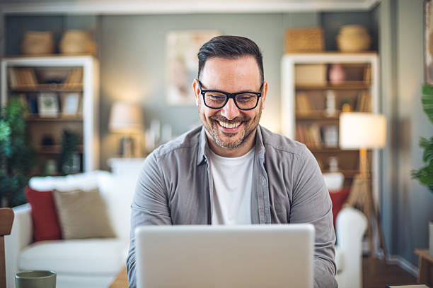 istock Smiling freelancer working from home on laptop 2211983047