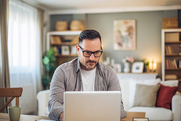 istock Focused freelancer working from home on laptop 2211983098