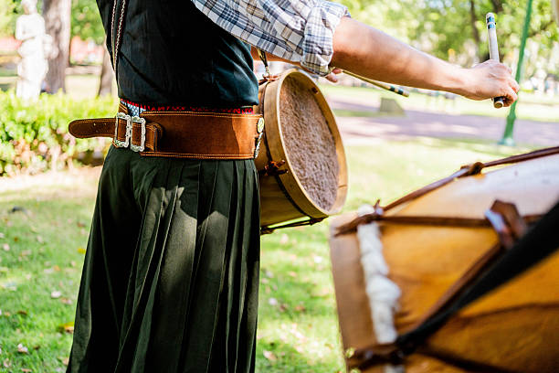 Close-up of a argentinian man playing drum during outdoor performance