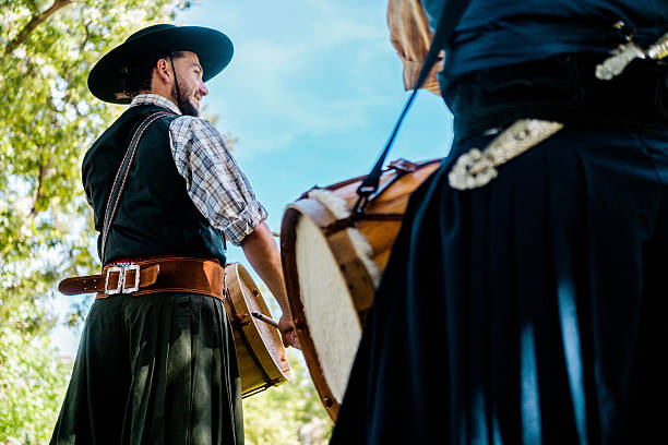 Woman with typical clothing, dancing to the music at the Traditional Harvest Festival in Toro. Parade of decorated cars, wine theme. Harvest Festival and Medieval Market in the old town of Toro. . Toro, Zamora, Castilla y Leòn, Spain - October 12, 2025.