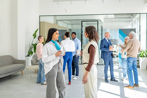 istock Bank professionals engage in a collaborative discussion about financial services and client support in a modern office setting 2211984956