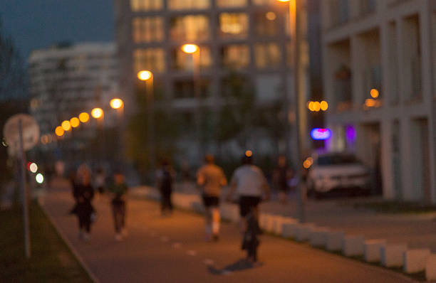 istock Enjoying an Evening Bicycle Ride and Jogging in an Urban Environment 2211985032