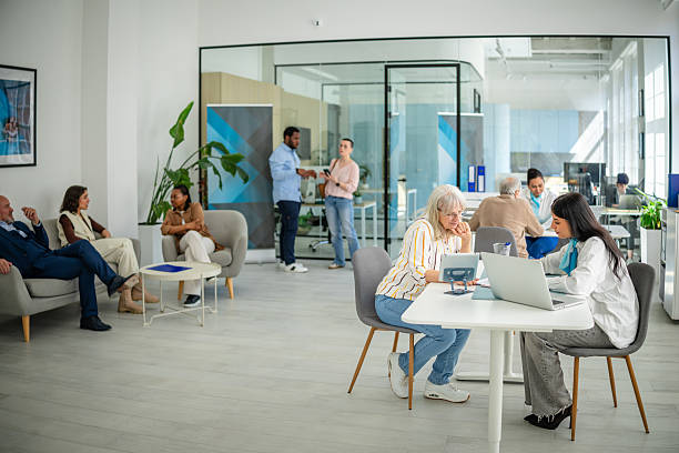 istock Discussion and collaboration in a modern bank office with diverse professionals engaged in financial planning and advice 2211986556