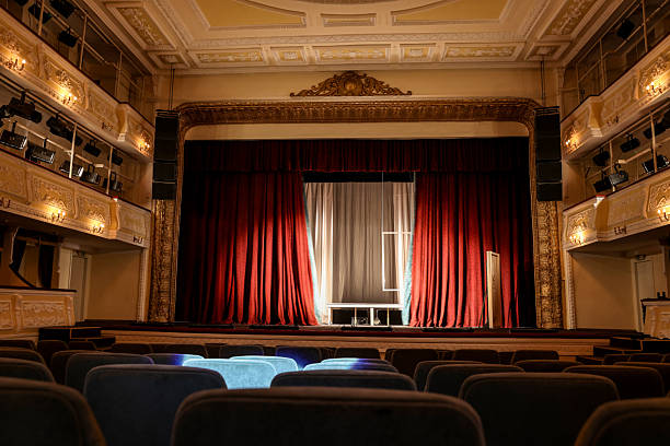 istock Theatre interior with stage and rows of comfortable seats 2211986900