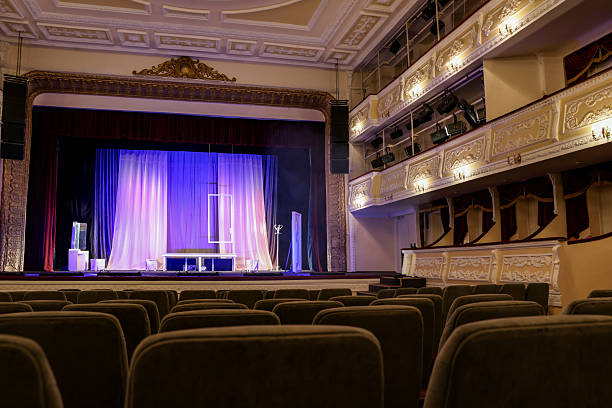 istock Theatre interior with stage and rows of comfortable seats 2211986954
