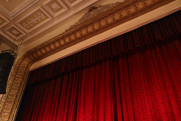 istock Elegant red curtains in theatre, low angle view 2211986955