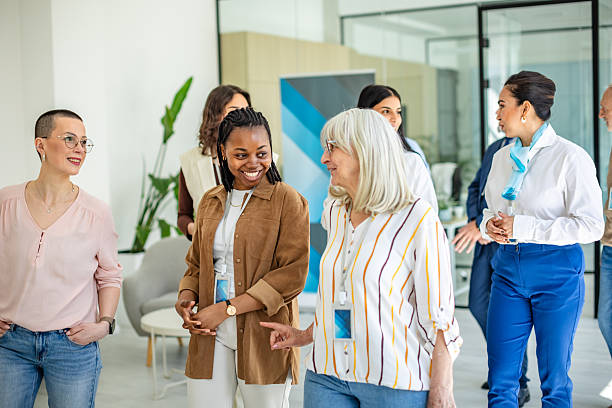 istock Diverse group engages in financial discussion at a modern bank office 2211987536