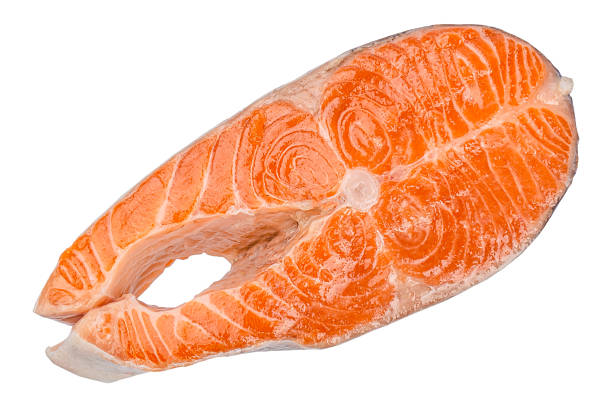 istock fresh raw salmon steak isolated on white background. Top view 2211989180