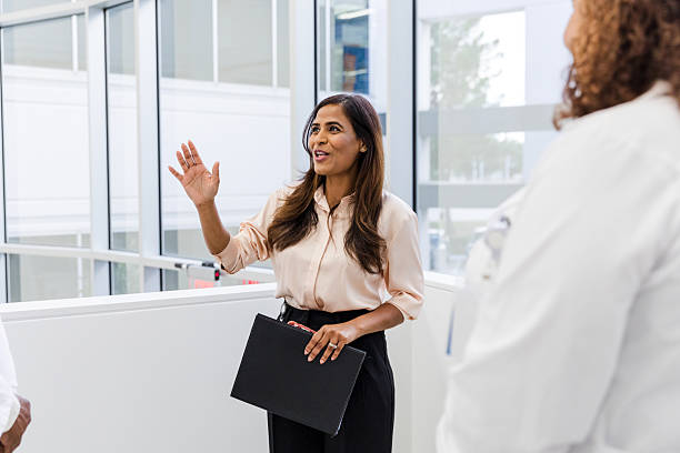 istock Confident businesswoman presenting ideas during a meeting 2211989752