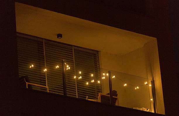 istock Turn your balcony into a cozy retreat with string lights for ambiance 2211990152