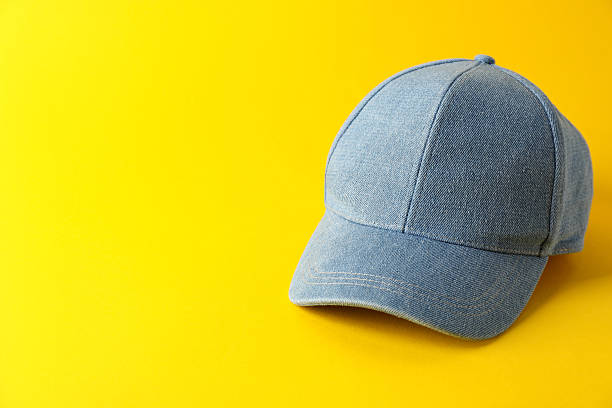 istock Stylish denim baseball cap on yellow background. Mockup for design 2211990767