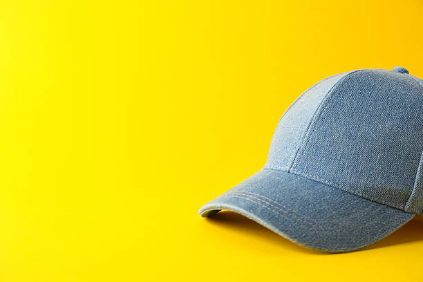 istock Stylish denim baseball cap on yellow background. Mockup for design 2211990803