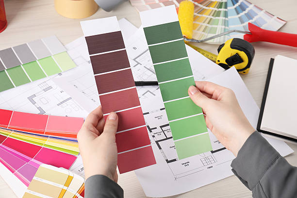 istock Designer with color selection chart working on house project at table, closeup 2211990826