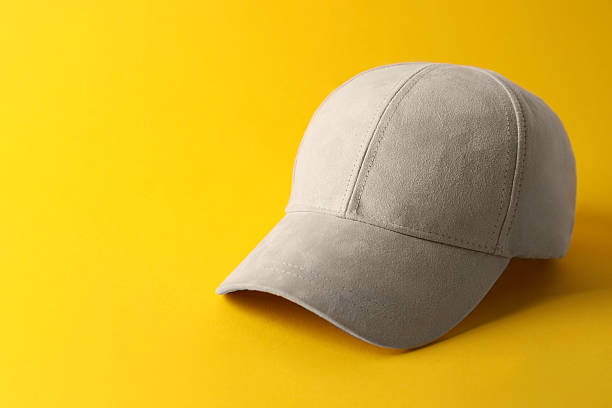istock Stylish baseball cap on yellow background. Mockup for design 2211990872