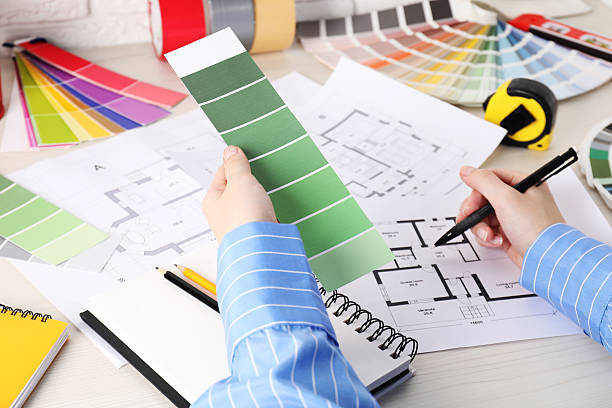 istock Designer with color selection chart working on house project at table, closeup 2211990874