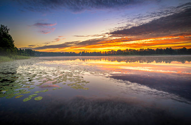 istock Beautiful summer sunset over the lake 2211993634