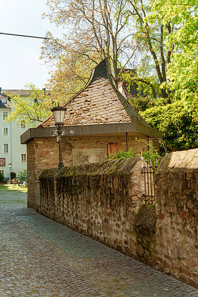 istock A brick wall in Mainz Germany with a small building on top of it 2211999186