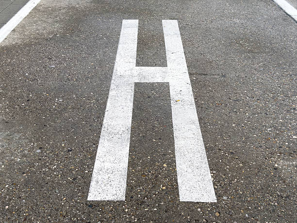 istock Helicopter landing pad marking on urban concrete surface 2211999535
