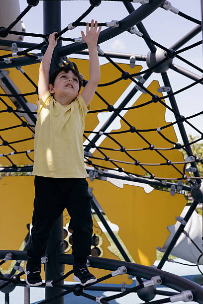 istock Little boy climbing on the playground 2212004320