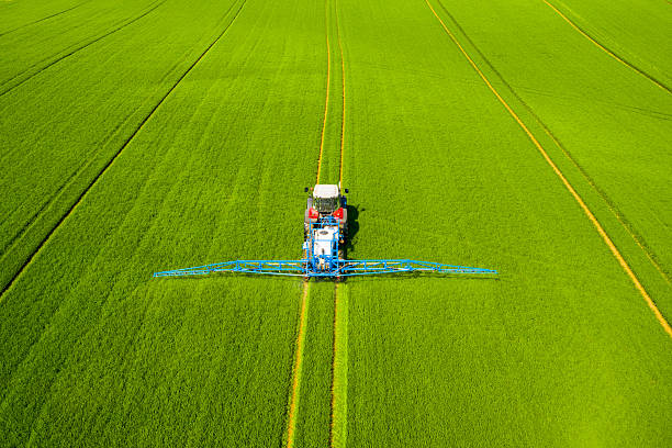 istock Tractor spraying pesticides. 2212005862
