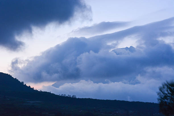 istock The mountain landscape looks charming surrounded by clouds 2212019202