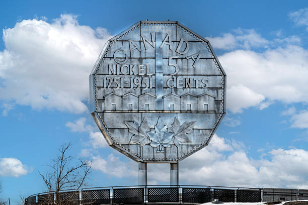 Sudbury, Canada - April 9, 2025: The Big Nickel is a 30 ft replica of a 1951 Canadian nickel in Sudbury, Ontario, a major mining center. It is the world's largest depiction of a coin. It is located on the grounds of the Dynamic Earth science museum on a hill.
