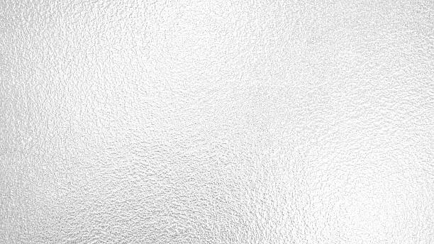 istock Grainy silver leaf bright aluminium foil texture tinfoil surface abstract gradient white gray metallic seamless background 2212026653