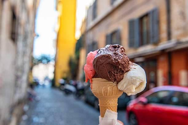 istock A hand holding an ice cream. Rome, Italy. 2212027045