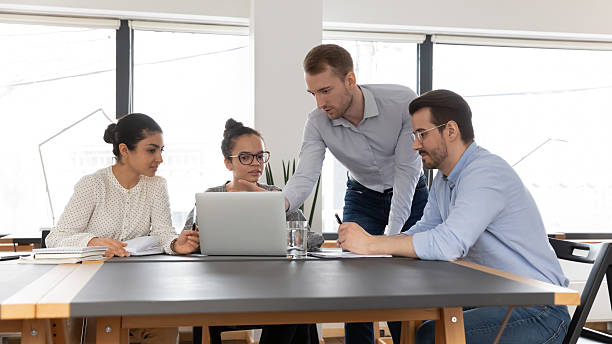 istock Project manager showing online presentation to colleagues 2212028841