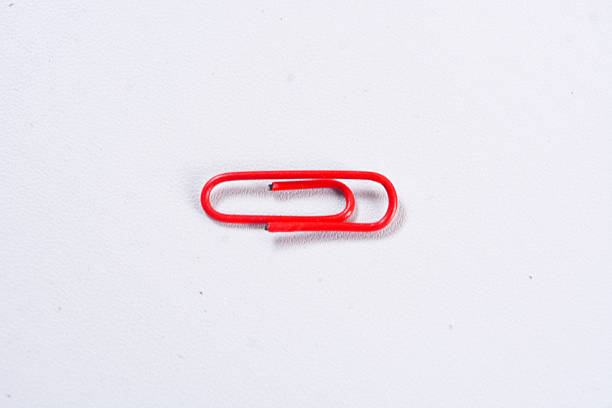 istock Realistic metal paper clip isolated on transparent background 2212029031