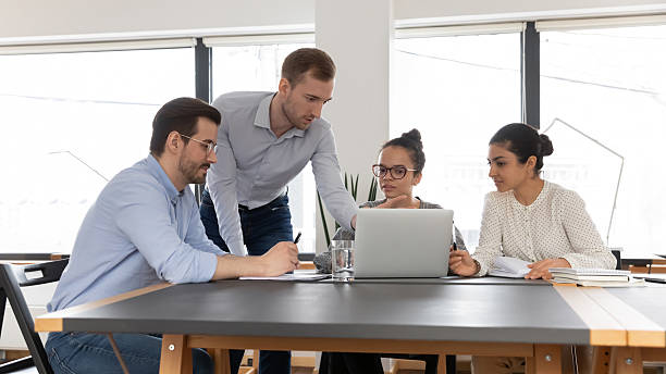 istock Project manager showing online presentation to colleagues 2212029082