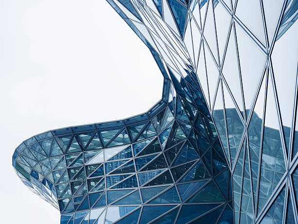 istock Steel curve Glass facade Modern building blue reflection Architecture details 2212029293