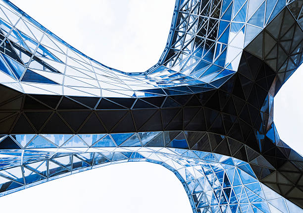 istock Steel curve Glass facade Modern building blue reflection Architecture details 2212029331
