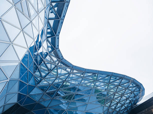 istock Steel curve Glass facade Modern building blue reflection Architecture details 2212029355