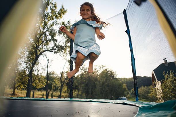 istock Beautiful girl enjoying summer on trampoline 2212039685