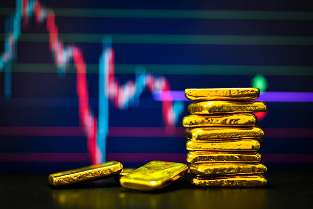 istock Photo a gold bars the candlestick chart background 2212043115