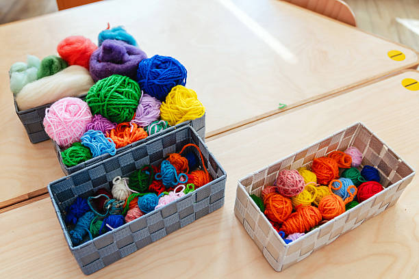 A close-up of a ball of yarn, showcasing the texture and details of the wool, perfect as a wallpaper