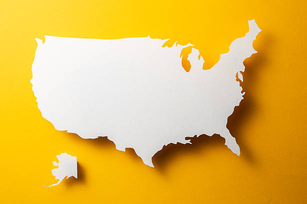 USA map paper texture cut out with shadow on yellow background.