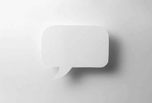 Paper speech bubble in the shape of a rectangle on a white background. Flat white chat icon in the form of an empty speech bubble.