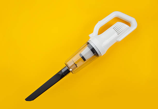 vacuum cleaner isolated on yellow background