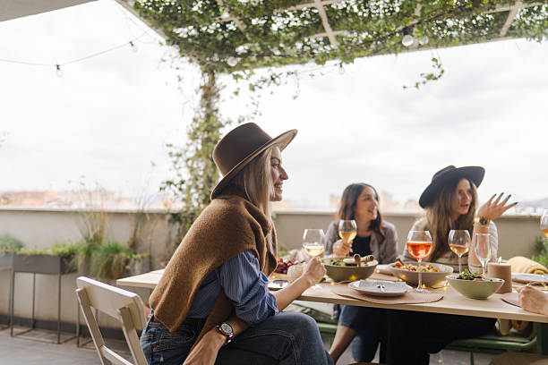istock Balcony dinner party with girlfriends 2212049539
