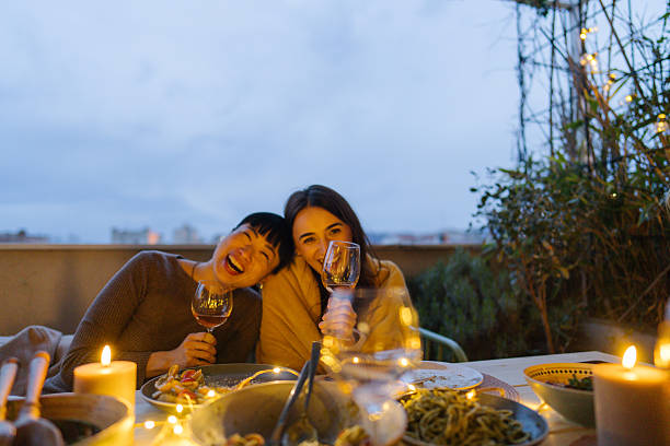 istock Two young women engaged in a conversation during house party 2212049546