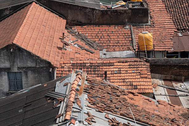 istock Damaged rooftops in a residential area 2212050362