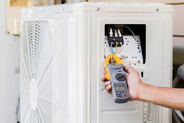 istock Air conditioning, HVAC service technician using gauges to check refrigerant and add refrigerant. 2212051045