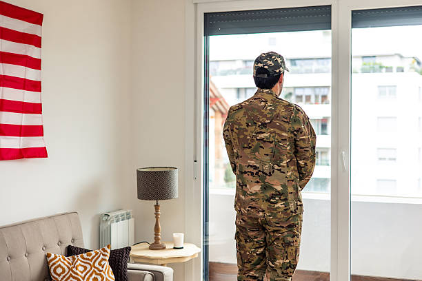 istock American soldier suffering from post-traumatic stress disorder looking outside the window 2212051231