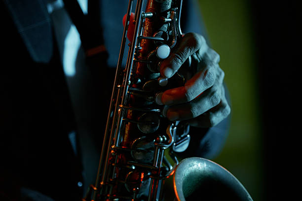istock Hand of Saxophonist Performing Music during Live Event under Blue Neon Light 2212052645