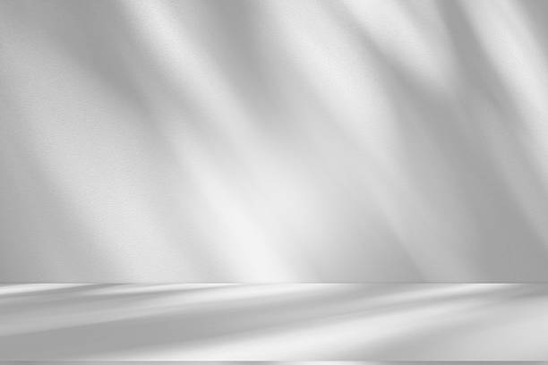 istock Wall interior background, studio and backdrops show products.with shadow from window color white and grey . background for text insertion and presentation product 2212054035