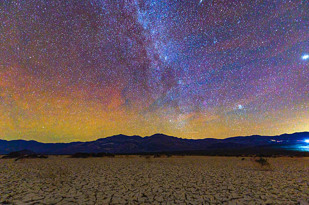 istock Milky Way Over Cracked Desert in Death Valley at Night 2212054599
