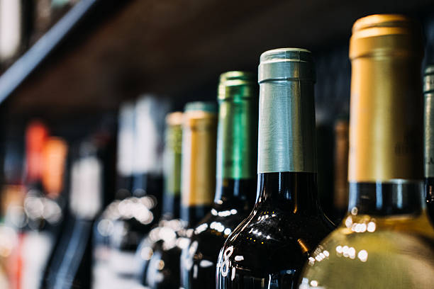 istock How choose wine. Assorted Wine Bottles on Display in a Store. A selective focus labels of a variety of wine bottles on a shelf, highlighting the diversity in a wine store. 2212054718